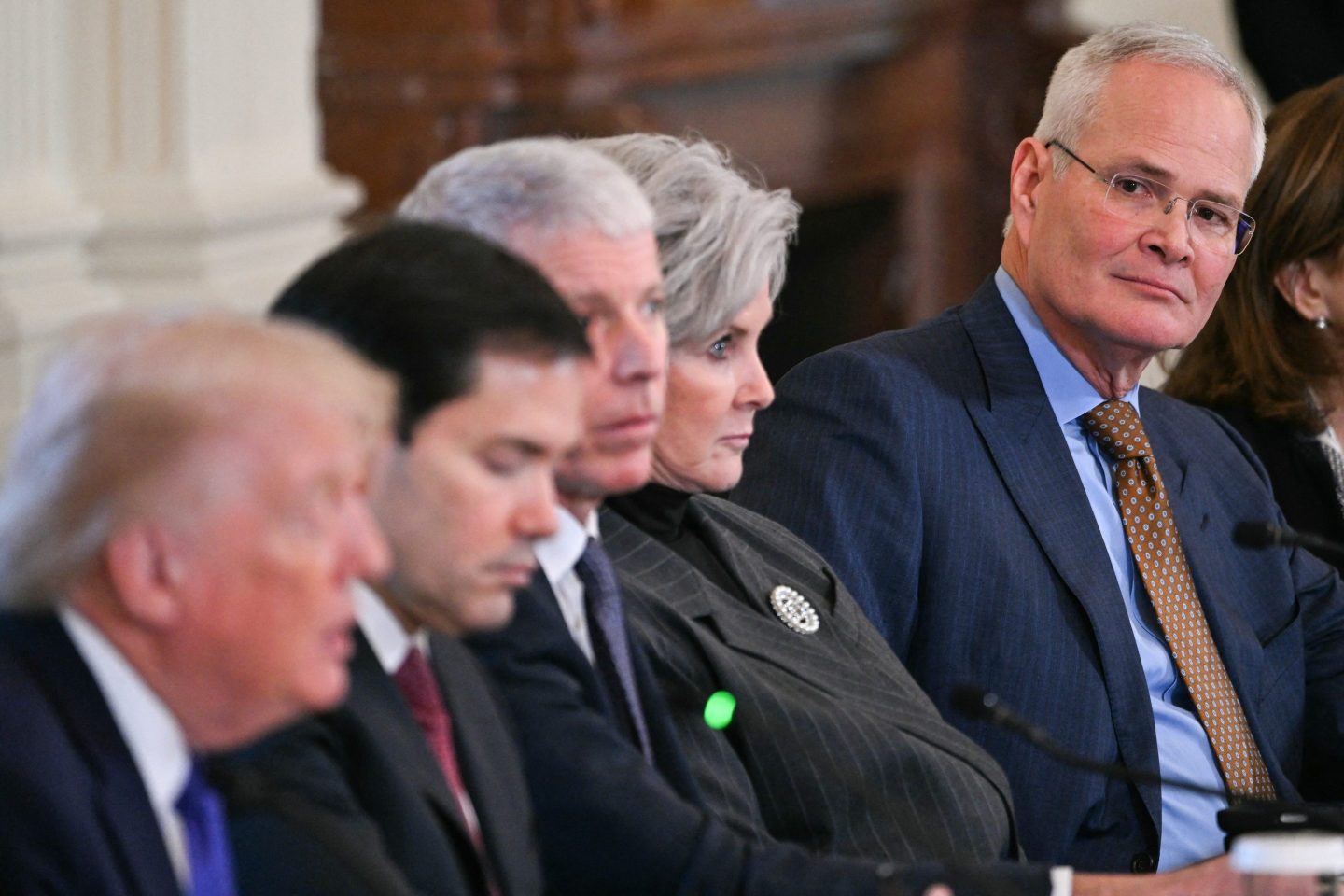 ExxonMobil CEO Darren Woods, far right, listens as U.S. President Donald Trump,left, speaks during a meeting with oil company executives in the East Room of the White House on Jan. 9. President Trump is aiming to convince oil executives to support his plans in Venezuela, a country whose energy resources he says he expects to control for years to come. US forces seized Venezuelan president Nicolas Maduro in a sweeping military operation on January 3, with Trump making no secret that control of Venezuela's oil was at the heart of his actions.