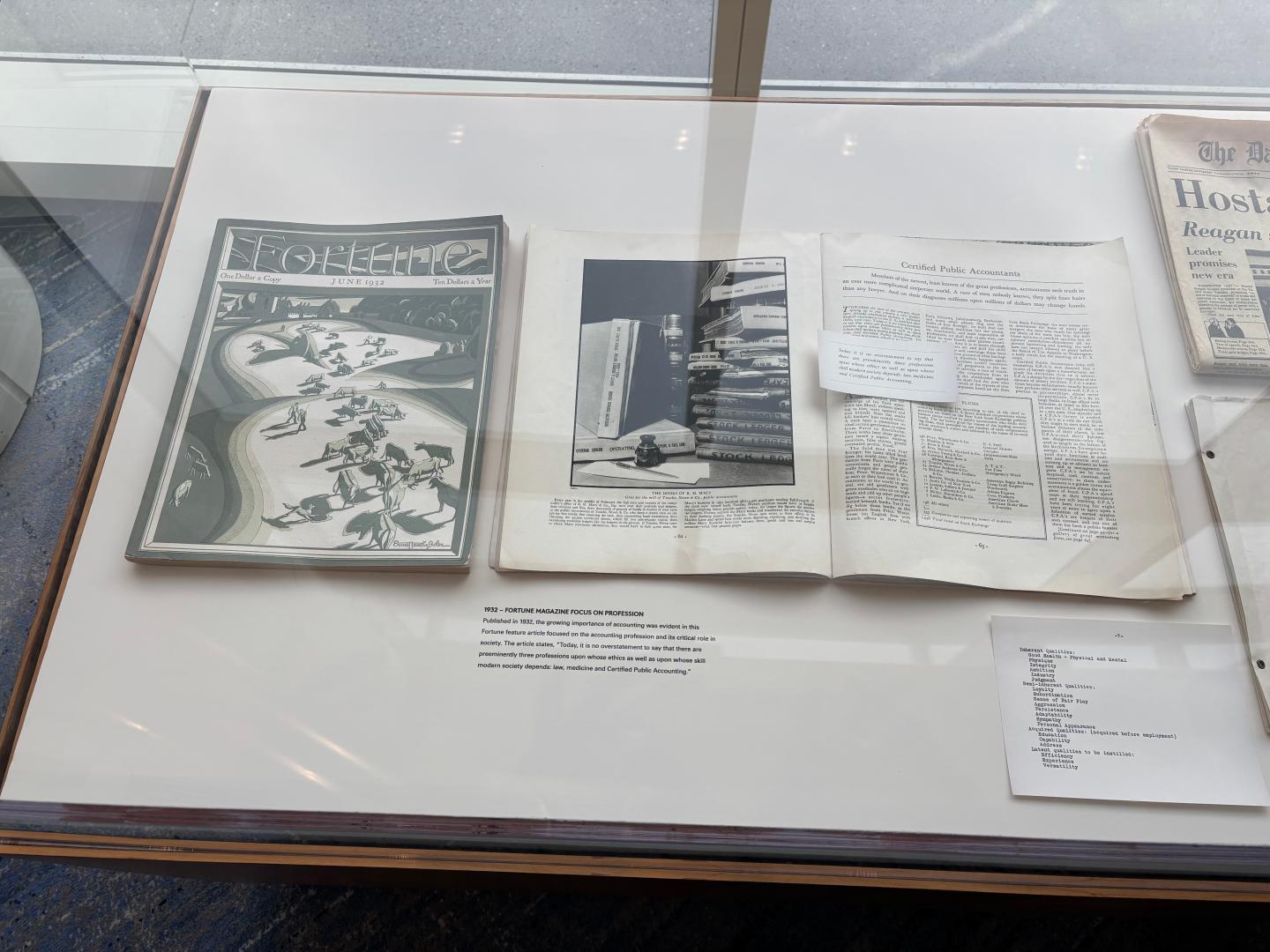 Historical documents and a vintage copy of Fortune magazine on display