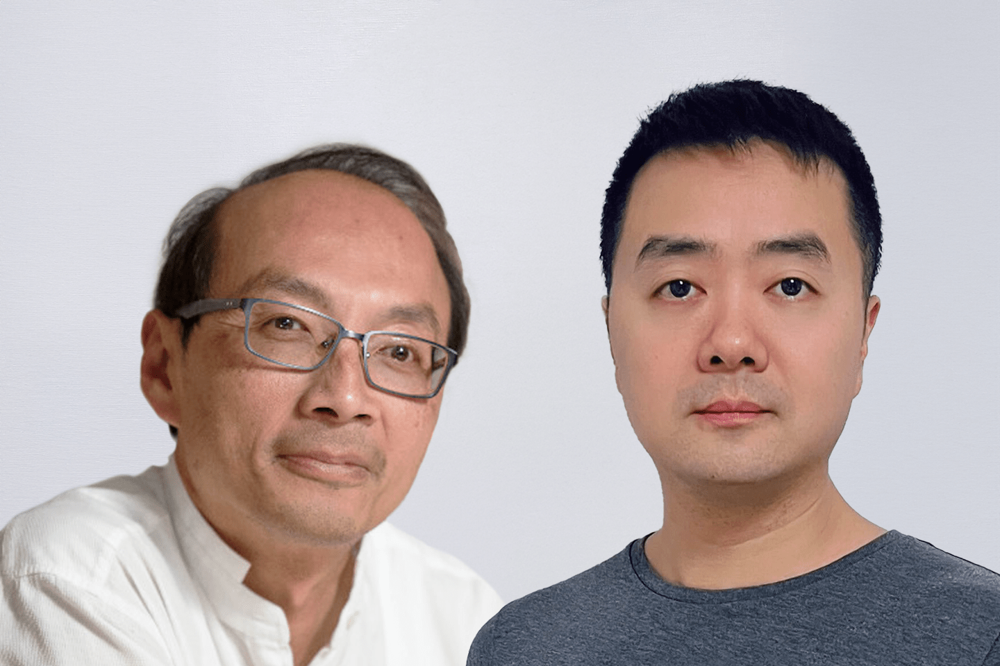 two men pose for camera