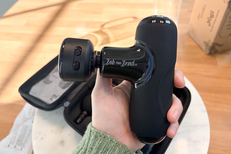 Bob & Brad's mini massage gun in our tester's hand.
