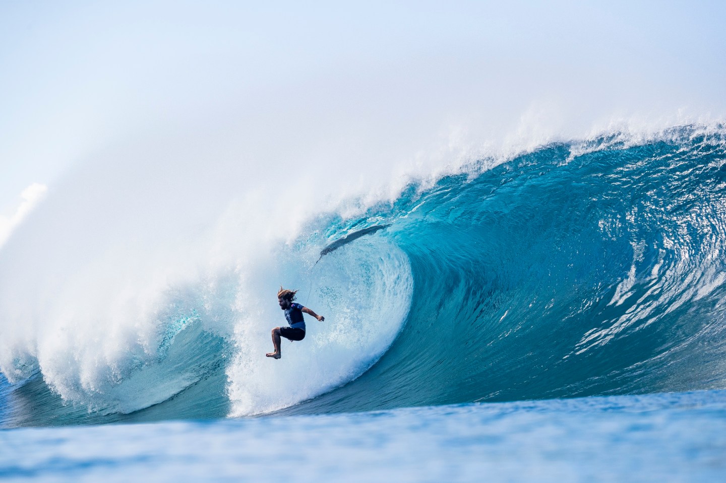Photo of a surfer in a huge wave