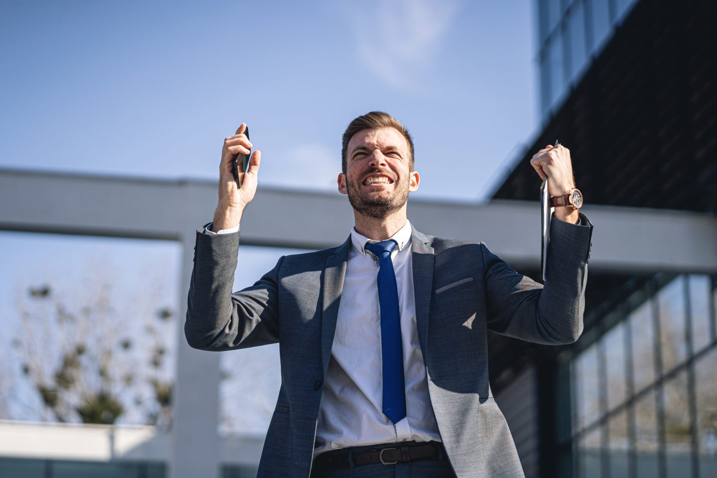 Happy adult businessman smiling after get promoted from the company he work for it