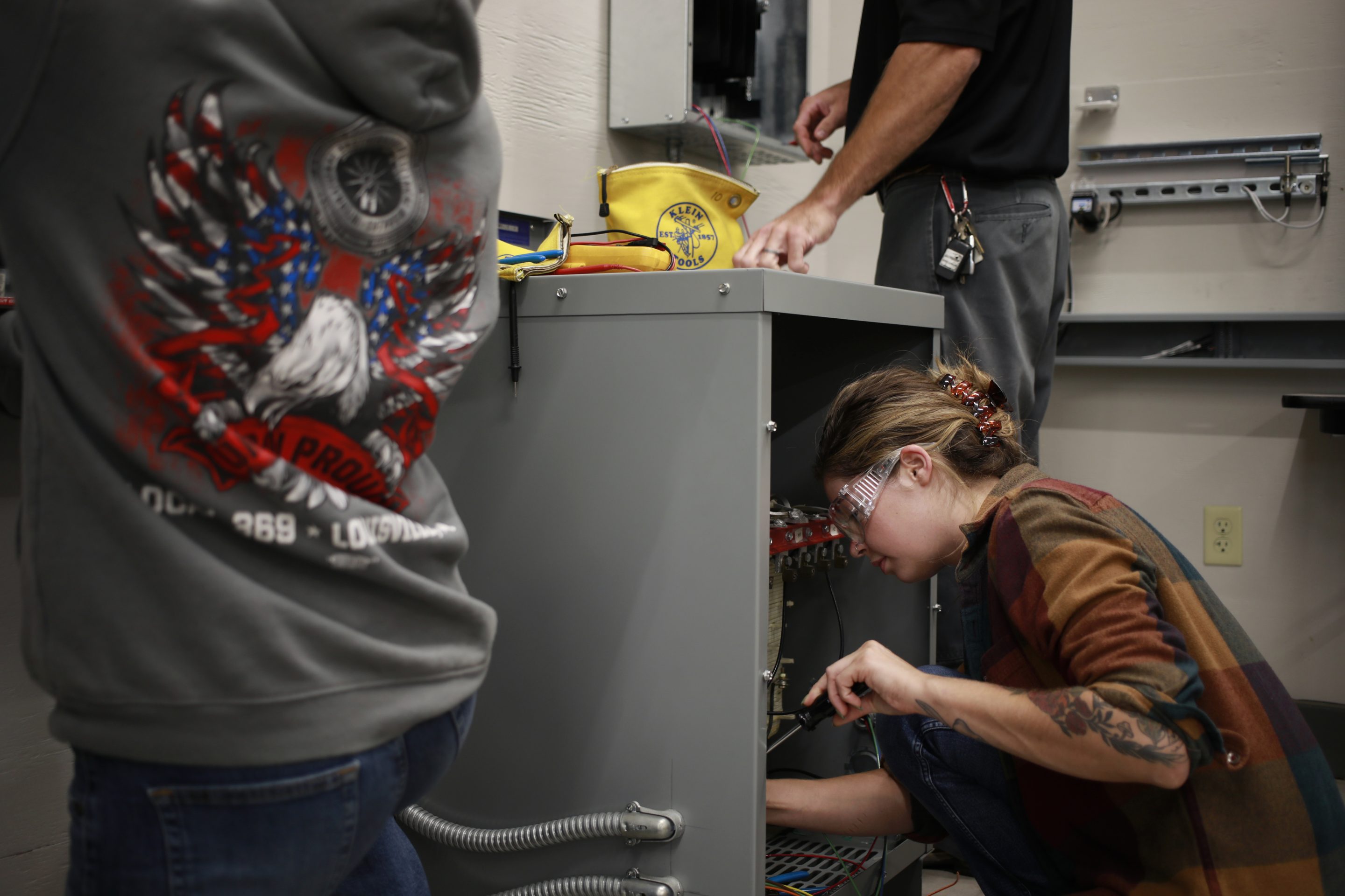 Electrician apprentices at work.