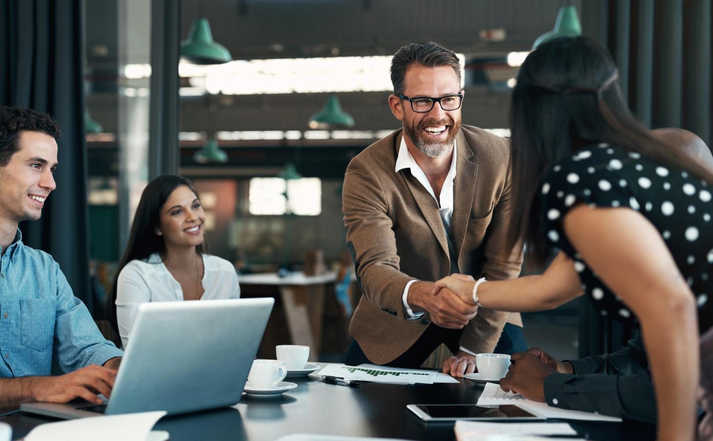 Photo of a boss meeting with workers