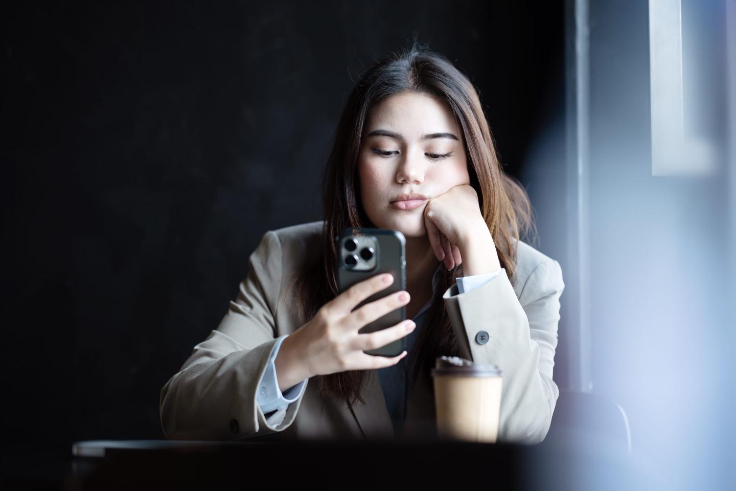 Young dejected worker on phone