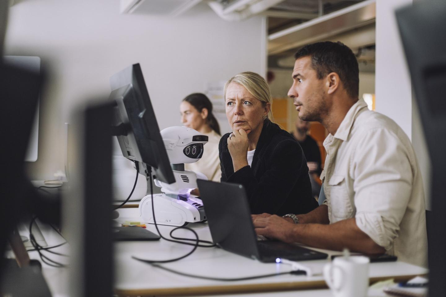 Workers using AI on desktop