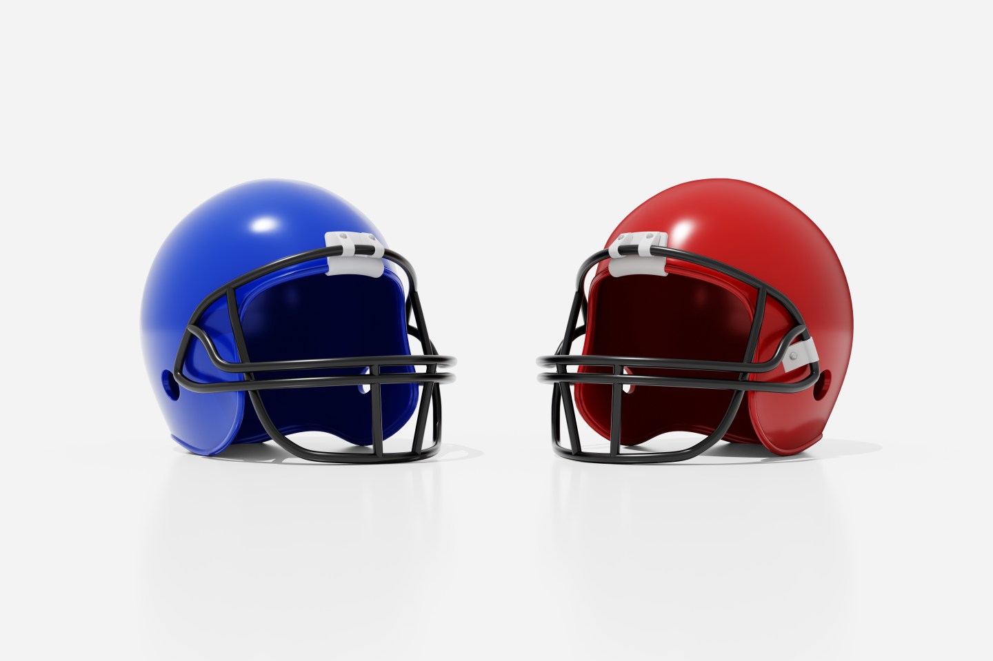 Two football helmets against a white background.