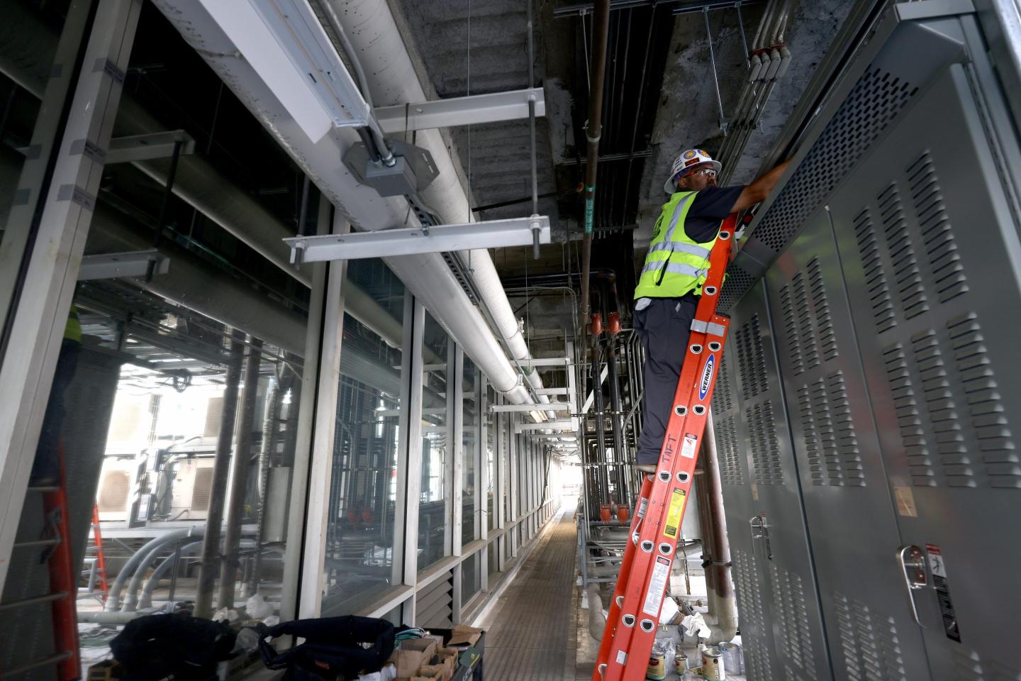 An electrician working to build a data center.