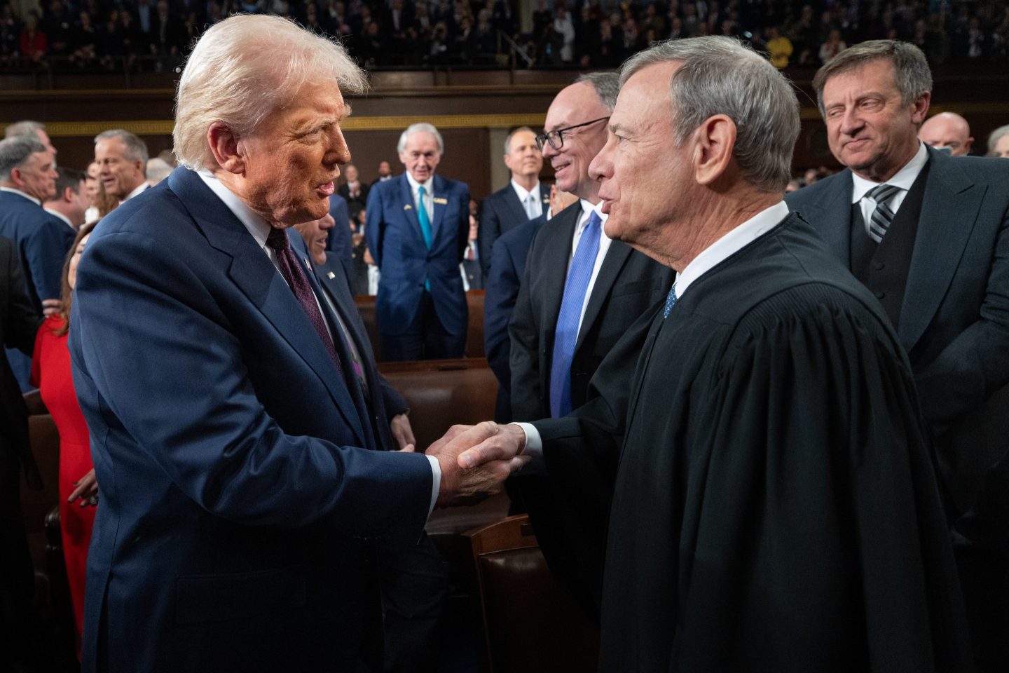 WASHINGTON, DC - MARCH 04: U.S. President Donald Trump (L) greets Chief Justice of the United States John G. Roberts, Jr as he arrives to deliver an address to a joint session of Congress at the U.S. Capitol on March 04, 2025 in Washington, DC. President Trump was expected to address Congress on his early achievements of his presidency and his upcoming legislative agenda.  (Photo by Win McNamee/Getty Images)