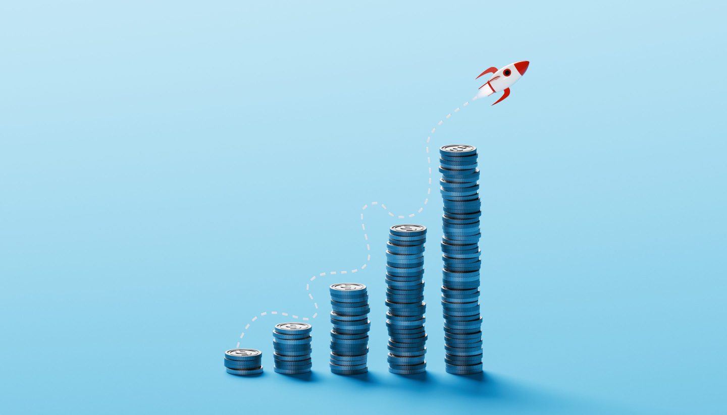 A bar chart with coins going up and to the right.