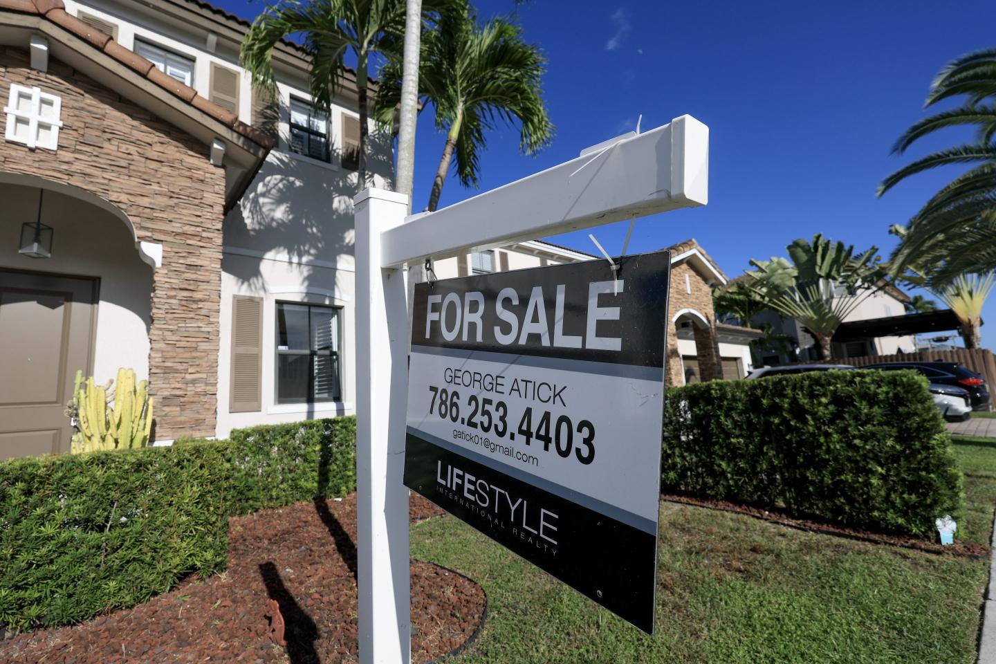 A home with a for sign in front.