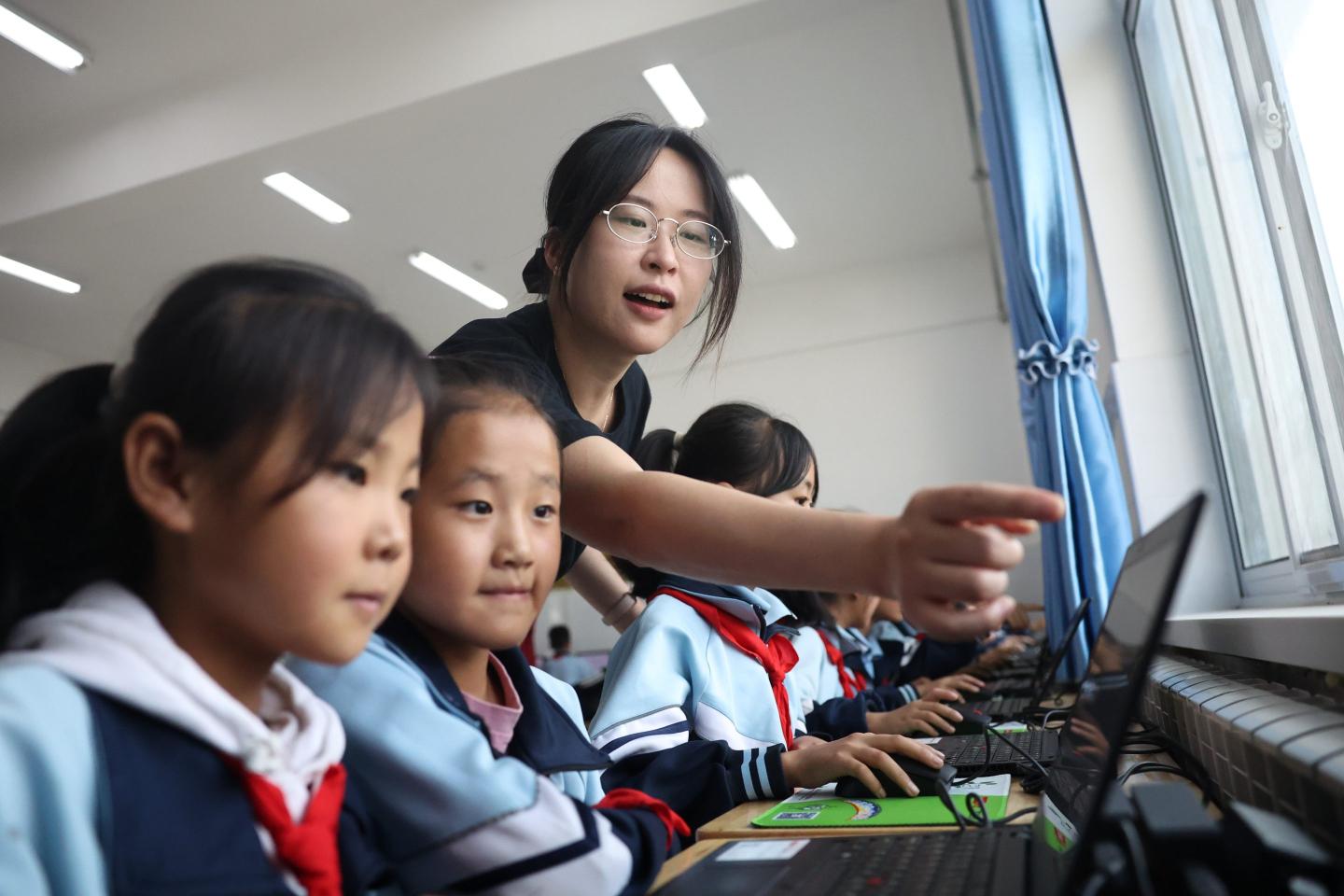 Chinese students working on laptops