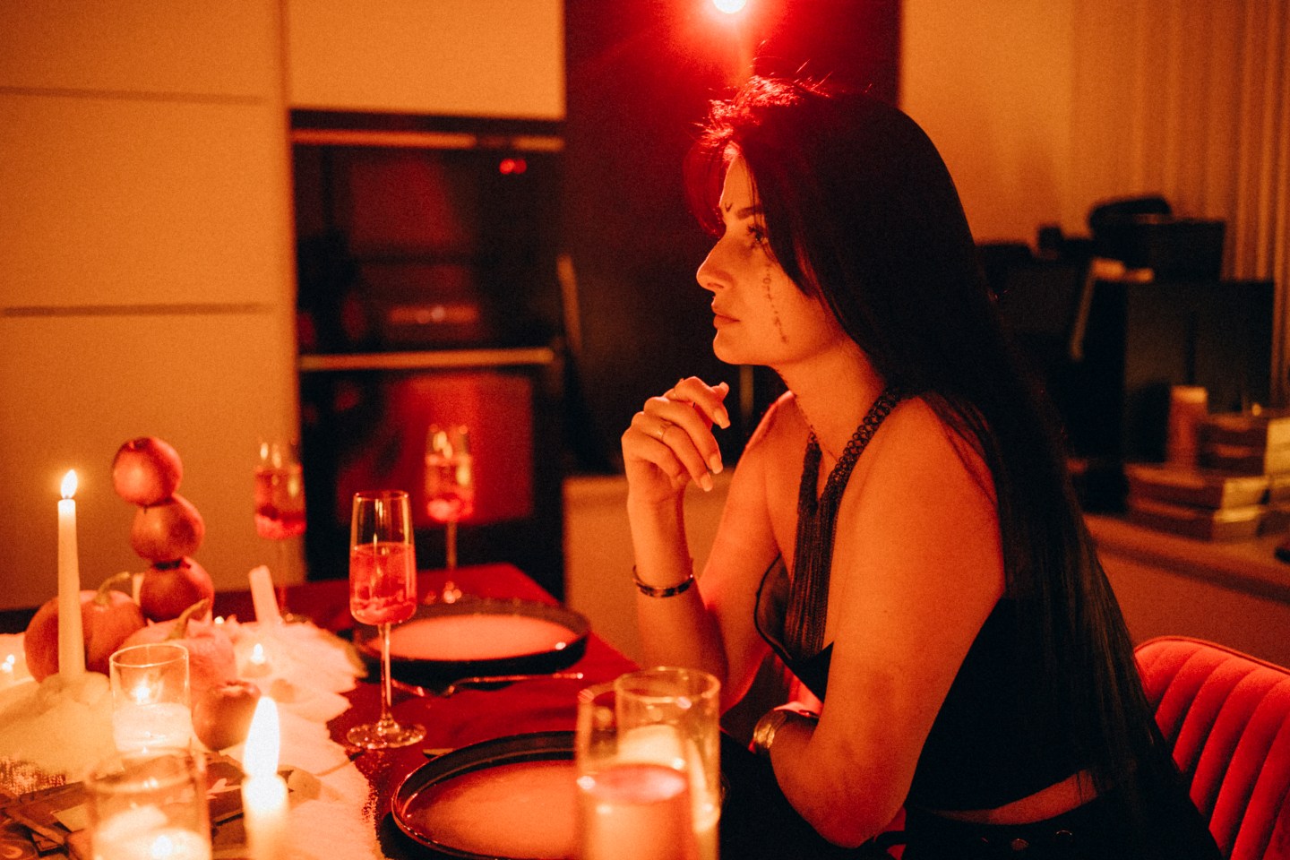Woman sitting alone at a dinner table
