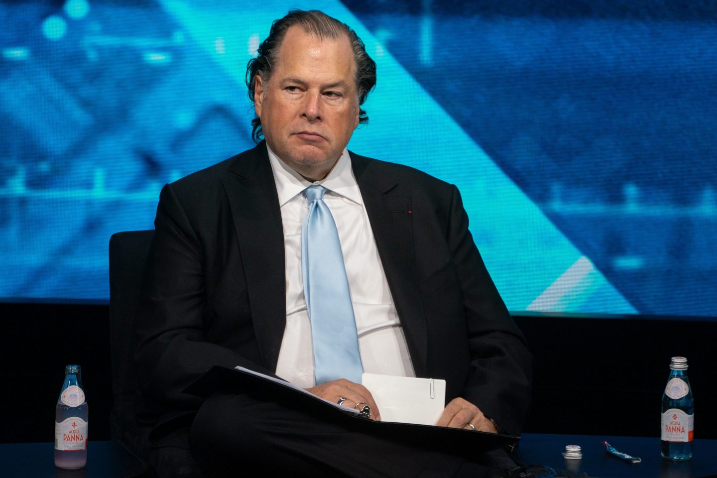 Salesforce founder and CEO Marc Benioff on stage, scowling.