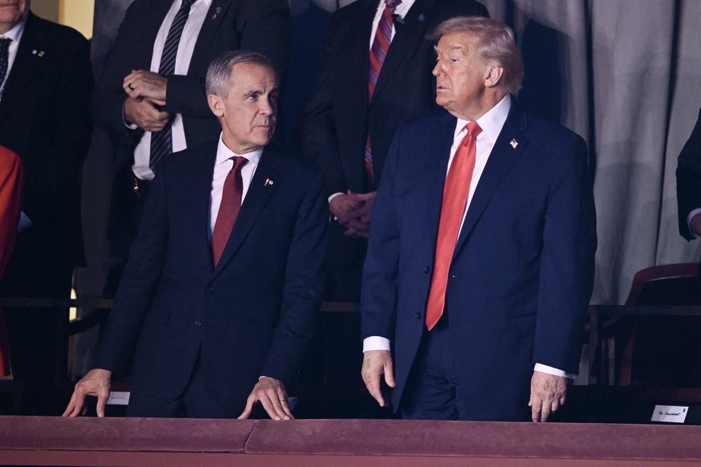 (L-R) Canada's Prime Minister Mark Carney and US President Donald Trump attend the draw for the 2026 FIFA Football World Cup taking place in the US, Canada and Mexico, at the Kennedy Center, in Washington, DC, on December 5, 2025.