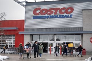 CHICAGO, ILLINOIS - DECEMBER 02: Customers walk in the parking lot outside a Costco store on December 02, 2025 in Chicago, Illinois. Costco is suing the Trump administration for a refund of tariffs the company alleges were improperly imposed by President Trump. The company contends that only Congress has the power to impose tariffs. (Photo by Scott Olson/Getty Images)