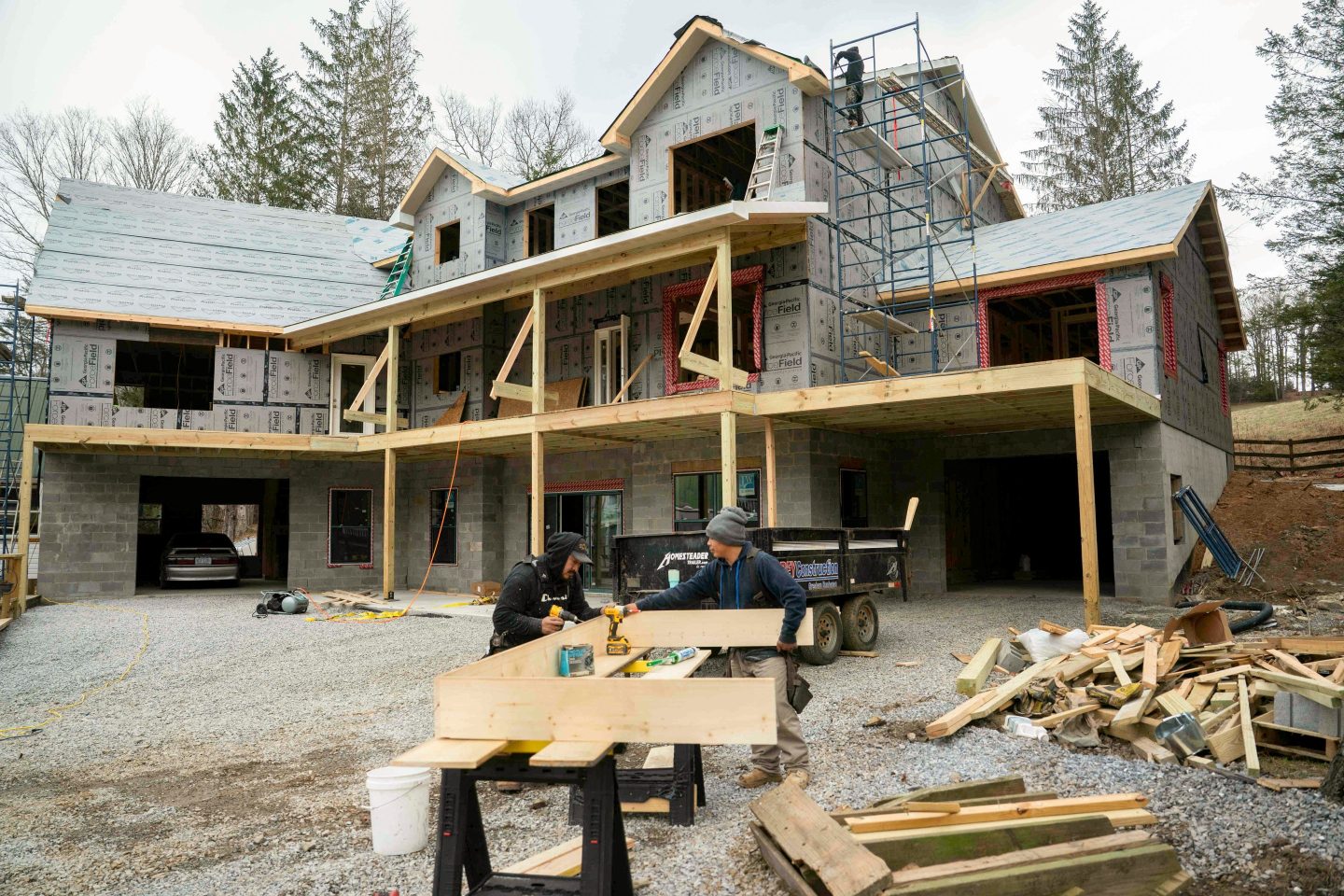 Employees of Grey Construction Company build a house for the company's owner after his home was destroyed by Hurricane Helene in Burnsville, North Carolina, US, on Friday, January 2,, 2026. The US Census Bureau is expected to release housing starts figures on January 9. Photographer: Allison Joyce/Bloomberg via Getty Images