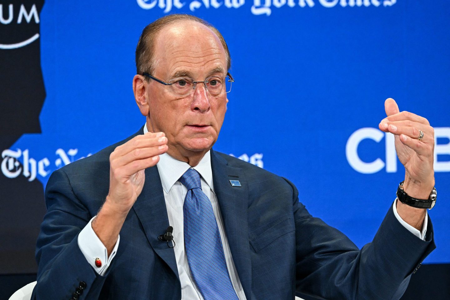 BlackRock chairman and WEF co-chairman Larry Fink gestures as he speaks during the World Economic Forum (WEF) annual meeting in Davos on January 21, 2026. The World Economic Forum takes place in Davos from January 19 to January 23, 2026. (Photo by Fabrice COFFRINI / AFP via Getty Images)