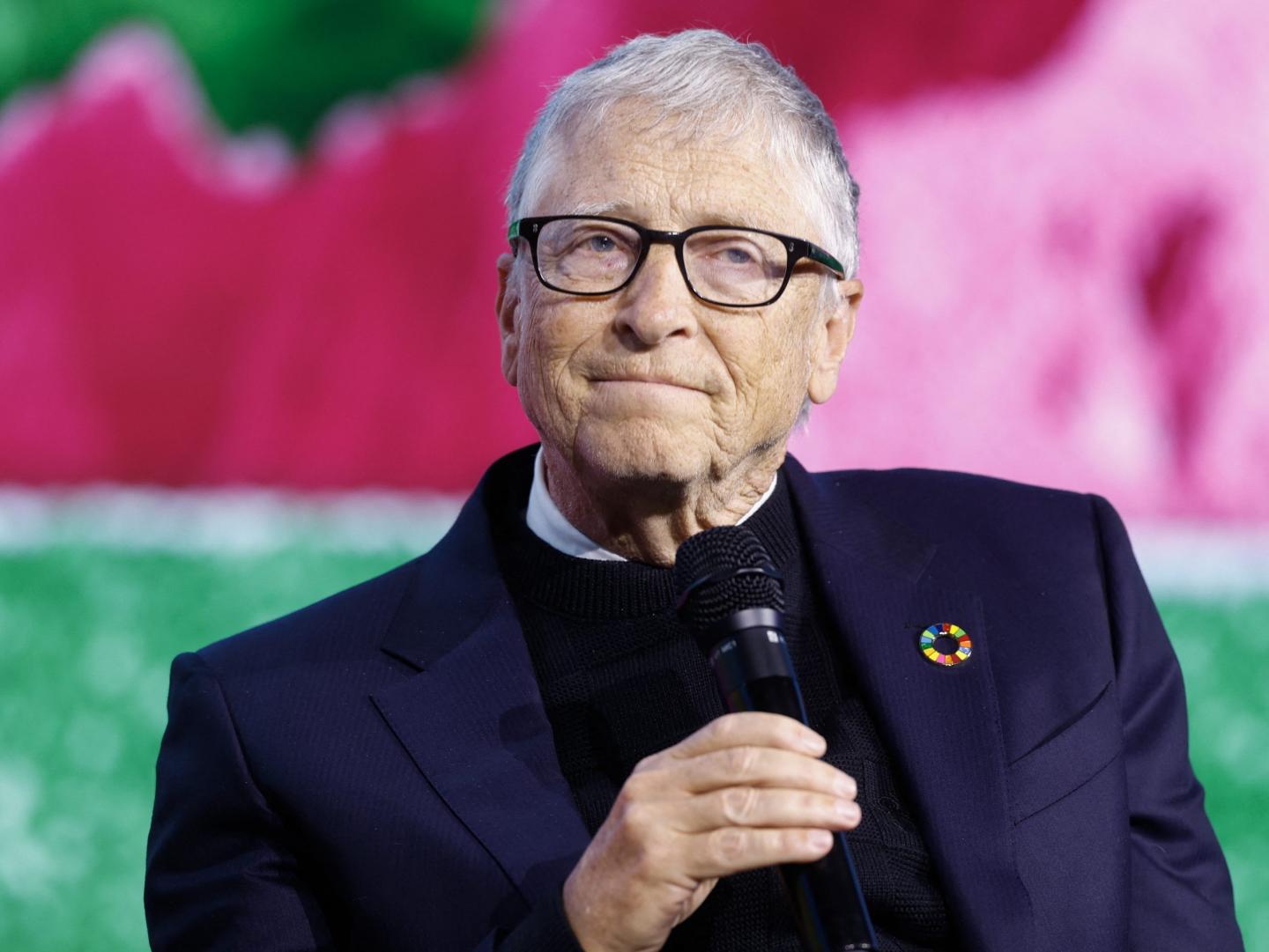 Bill Gates speaking into a mic.