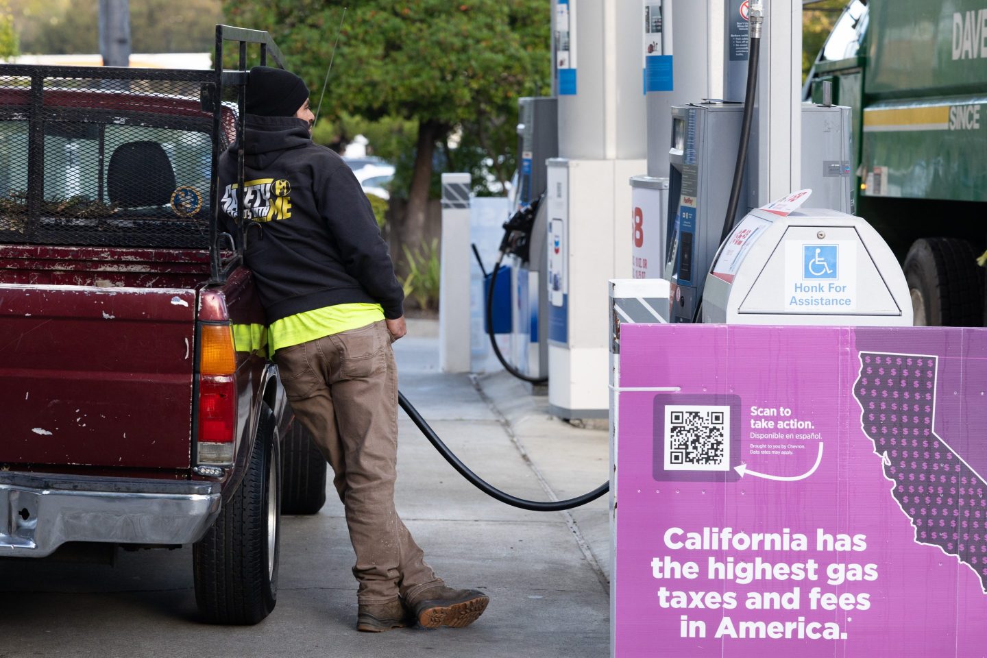 A driver refuels a vehicle at a Chevron gas station in San Mateo, California, US, on Thursday, Jan. 29, 2026. Chevron Corp. is expected to release earnings figures on January 30. Photographer: Benjamin Fanjoy/Bloomberg via Getty Images