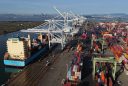 a container ship is seen docked at the Port of Oakland