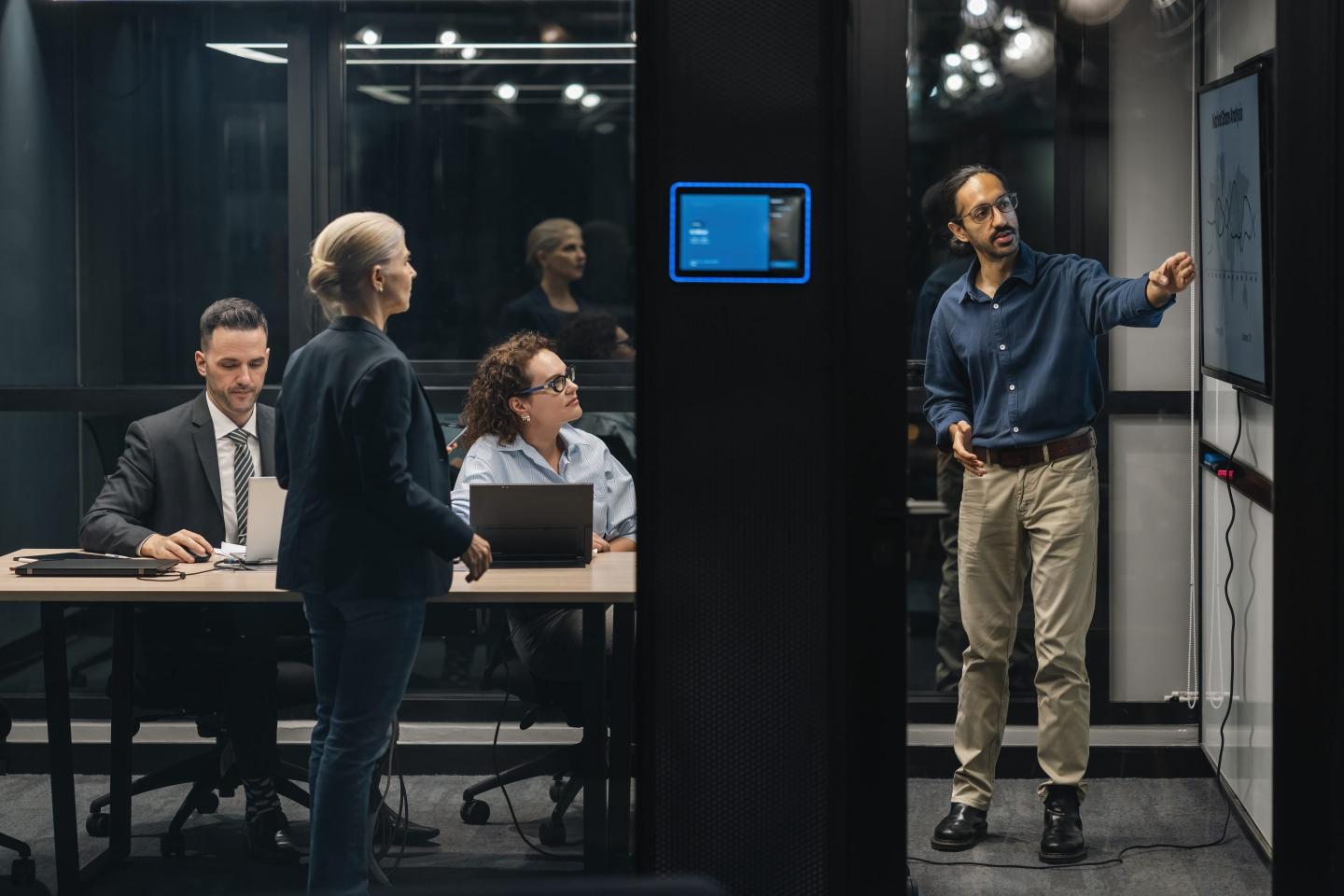 Photo of several people working on a presentation together