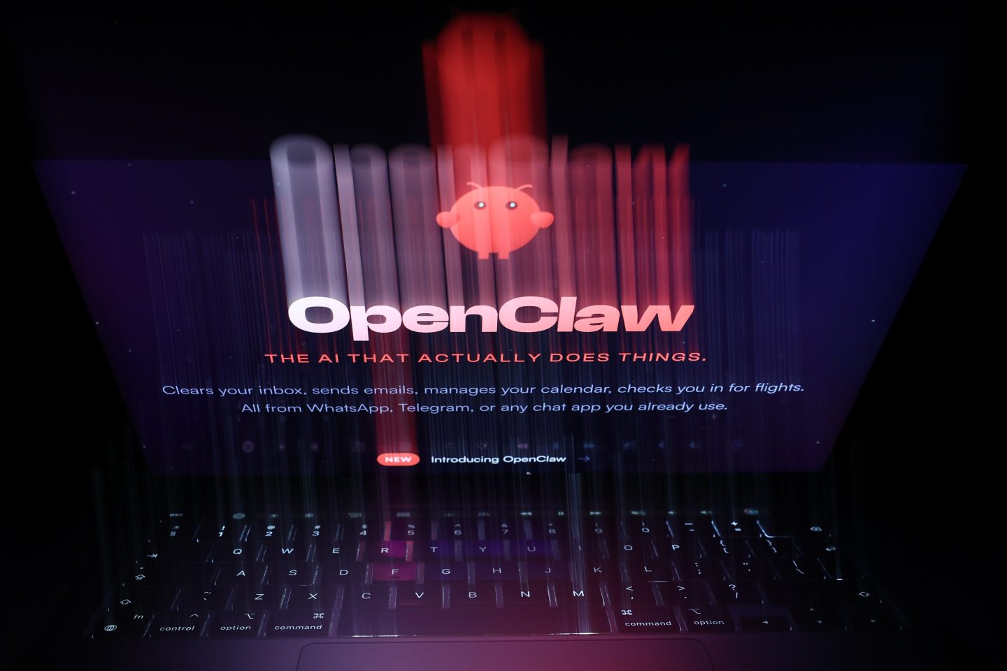 A laptop displaying the OpenClaw logo