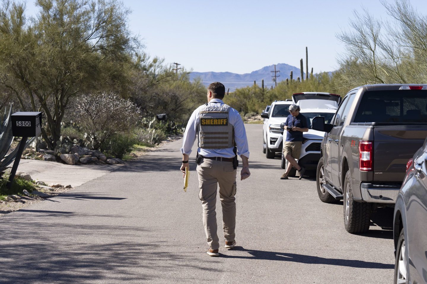 man in sheriff uniform patrols neighborhood