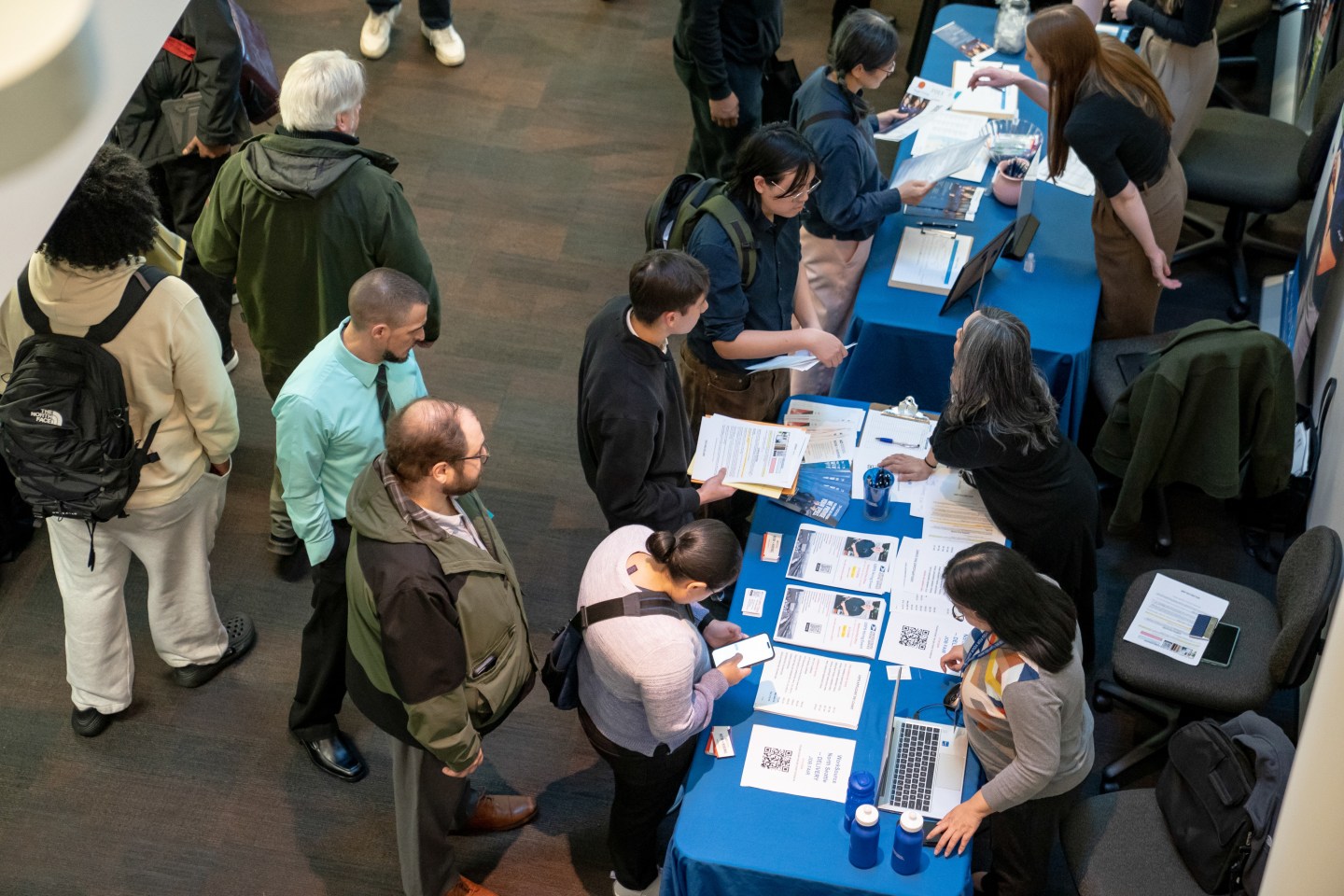 Jobseekers speak with recruiters during the WorkSource North Seattle Career Fair in Seattle, Washington, US, on Tuesday, Feb. 10, 2026. 