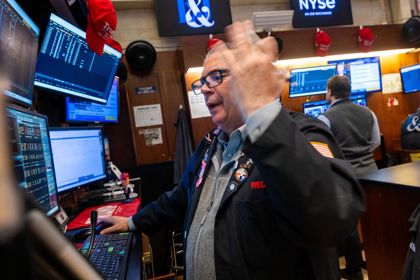 Traders work on the floor of the New York Stock Exchange (NYSE) on February 13, 2026 in New York City.