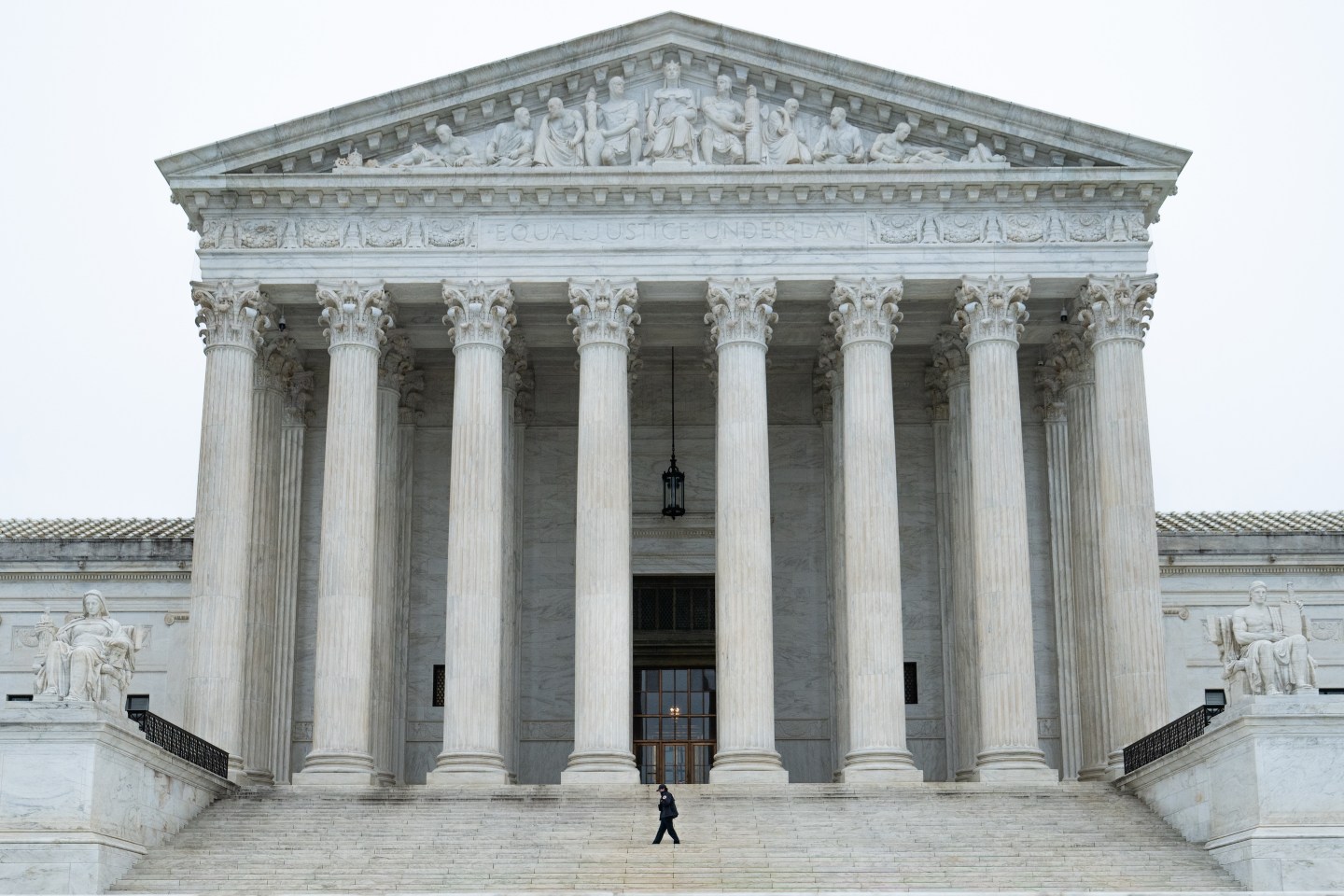 A security guard on the steps of the US Supreme Court in Washington, DC, US, on Friday, Feb. 20, 2026.