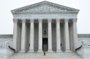 A security guard on the steps of the US Supreme Court in Washington, DC, US, on Friday, Feb. 20, 2026.