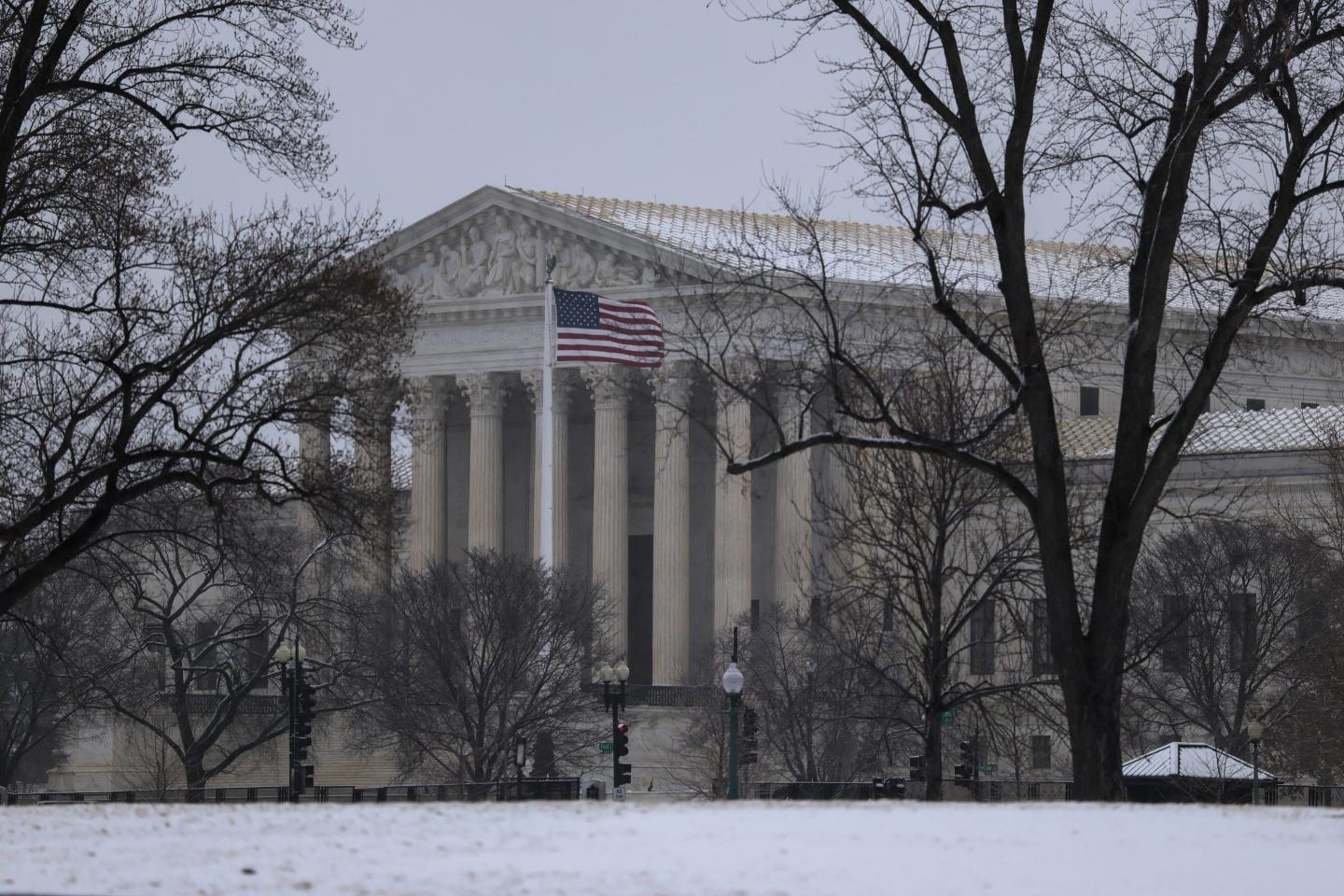 Snow falls on the U.S. Supreme Court building.
