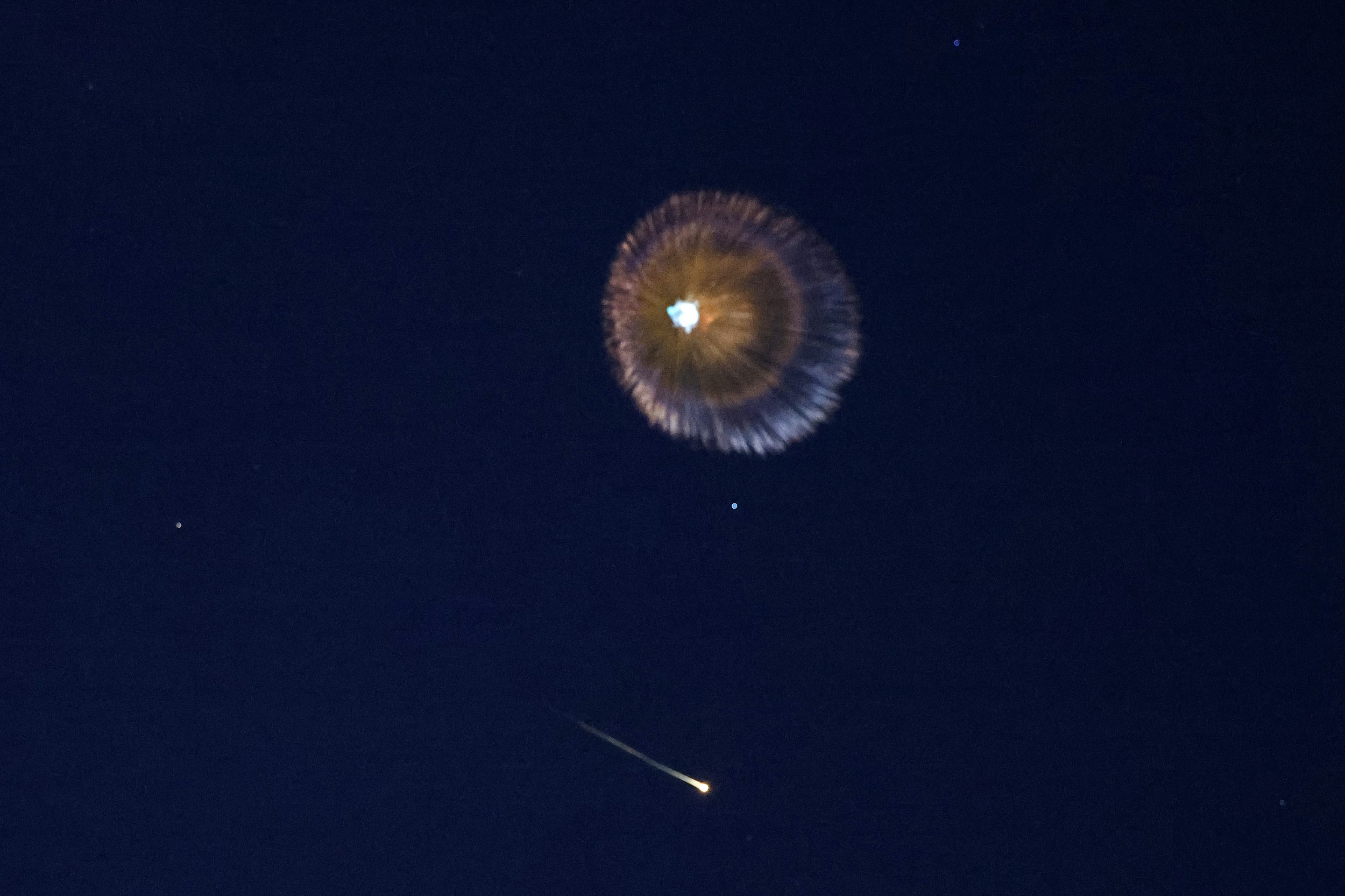 Explosions from projectile interceptions by Israel's missile defense system are pictured over the Israeli coastal city of Netanya, on February 28, 2026. 
