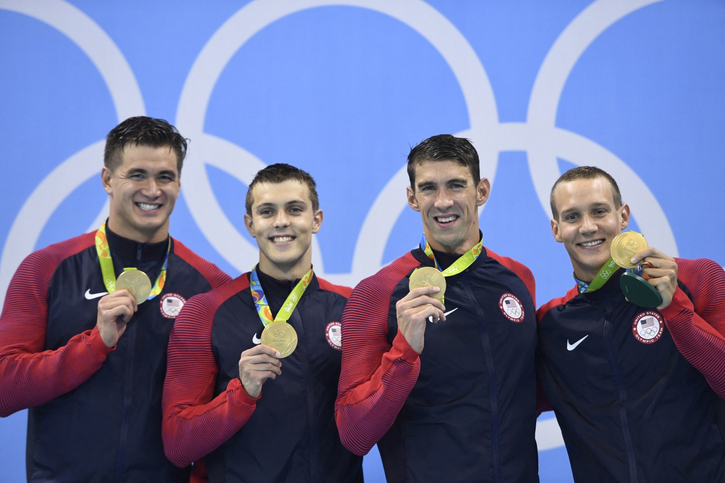 Olympic champions like two-time gold medalist Ryan Held (pictured center left) are finding a new start at Goldman Sachs after retiring from sports.