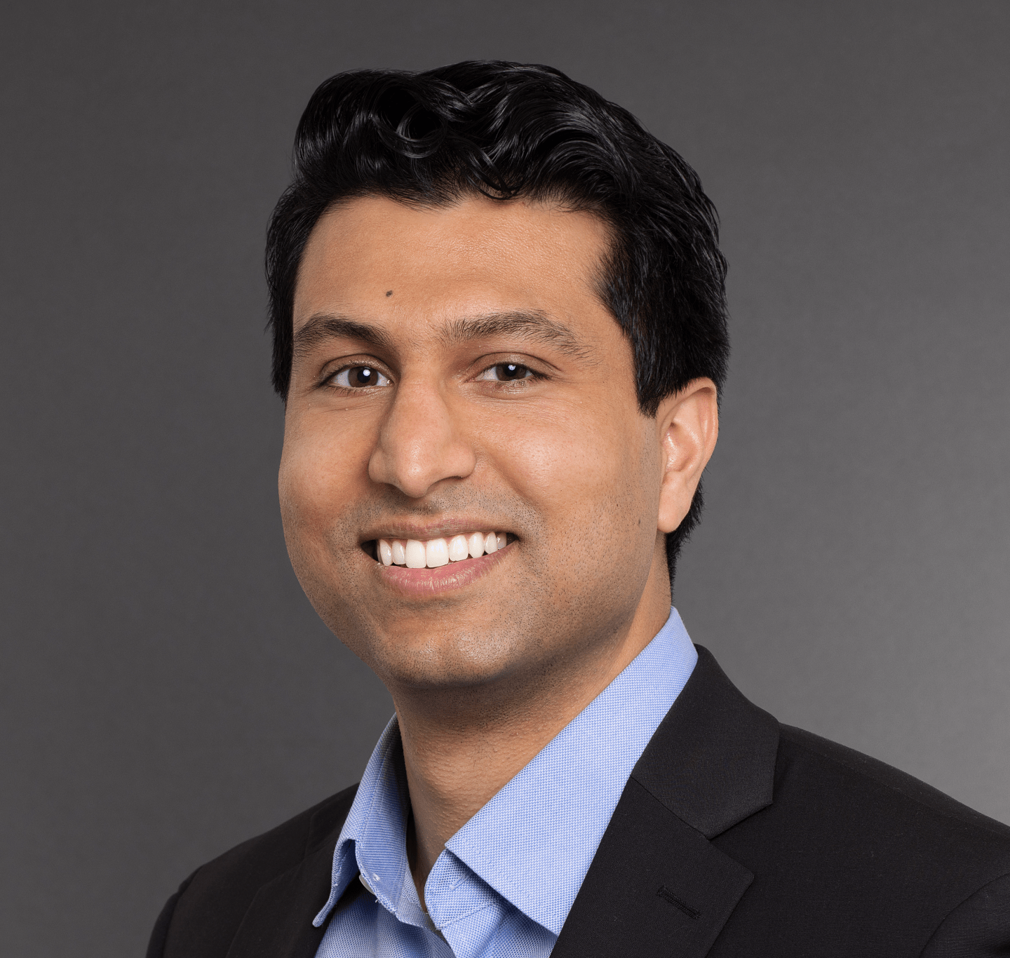 man smiles to camera