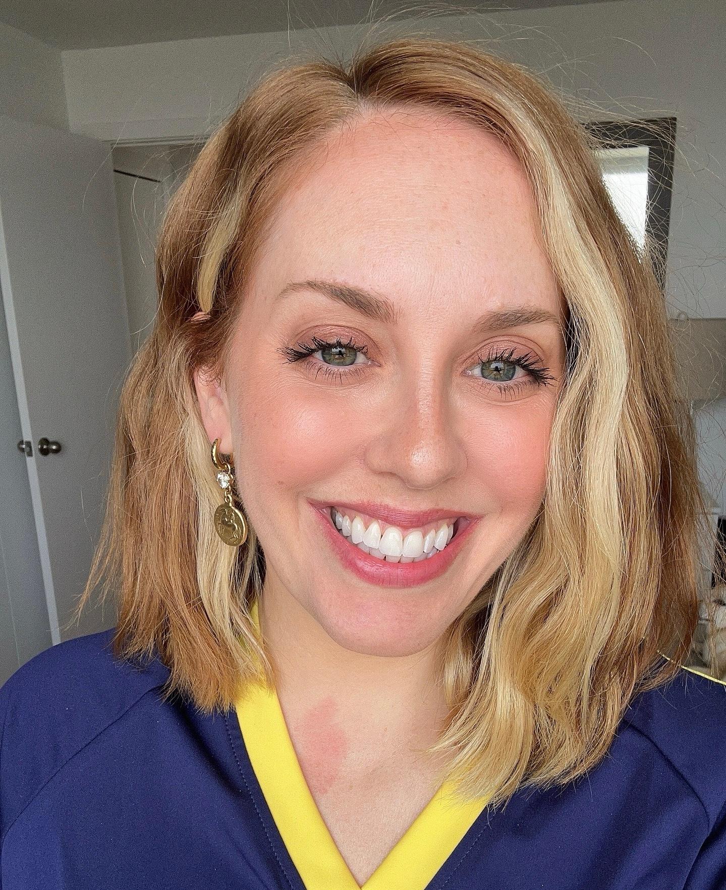 Woman wearing a purple shirt.