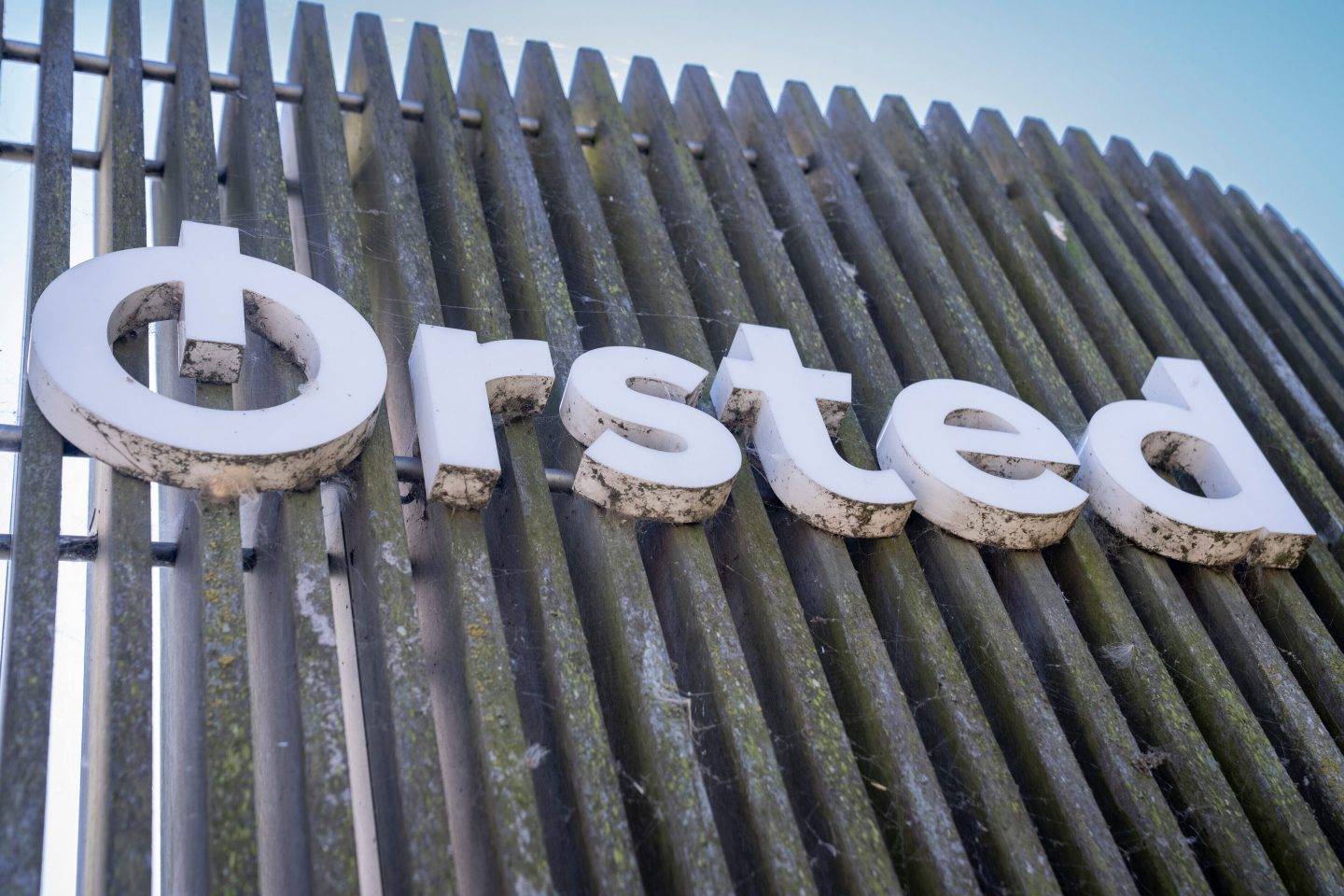 Orsted logo on a metal fence