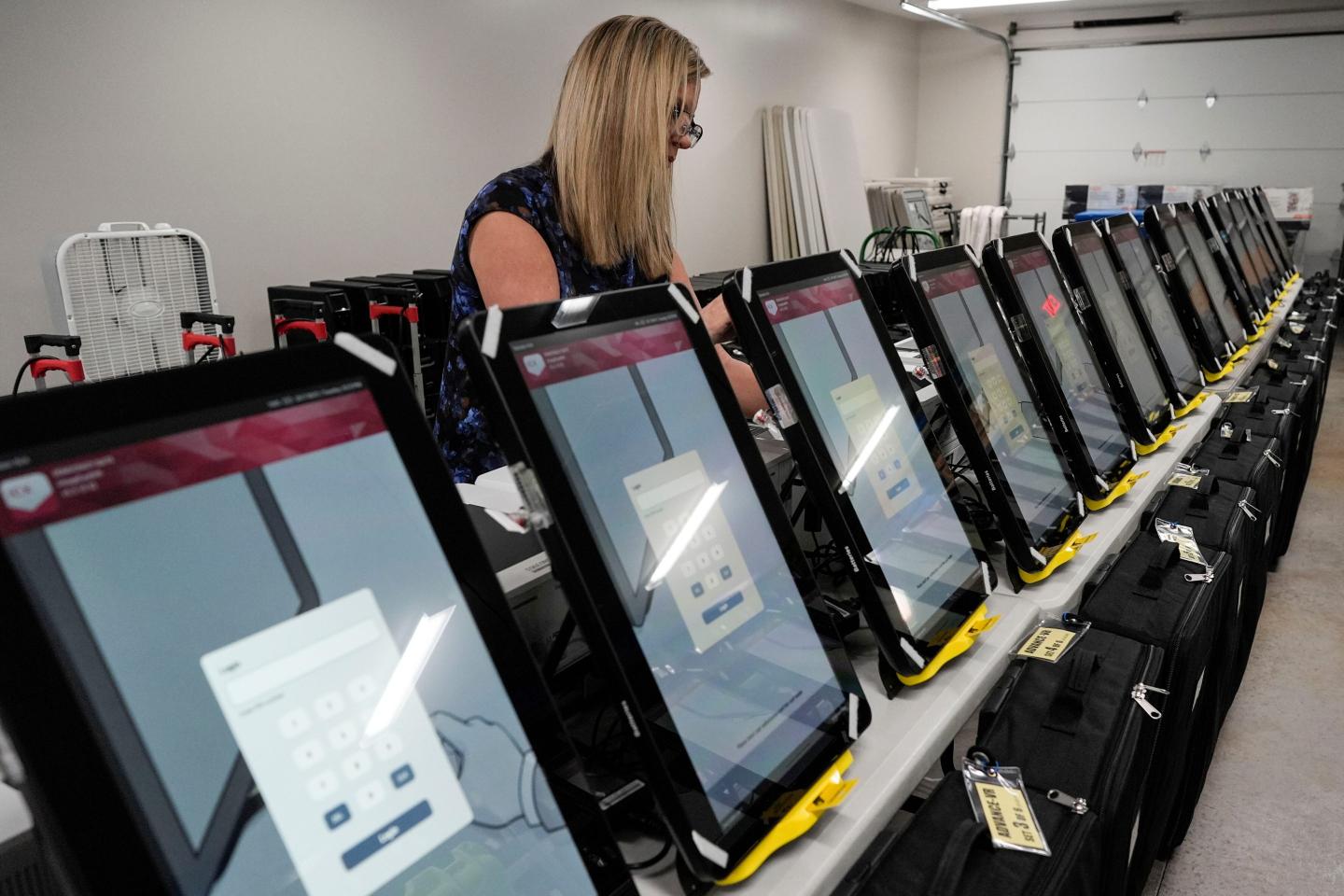 woman near voting machines