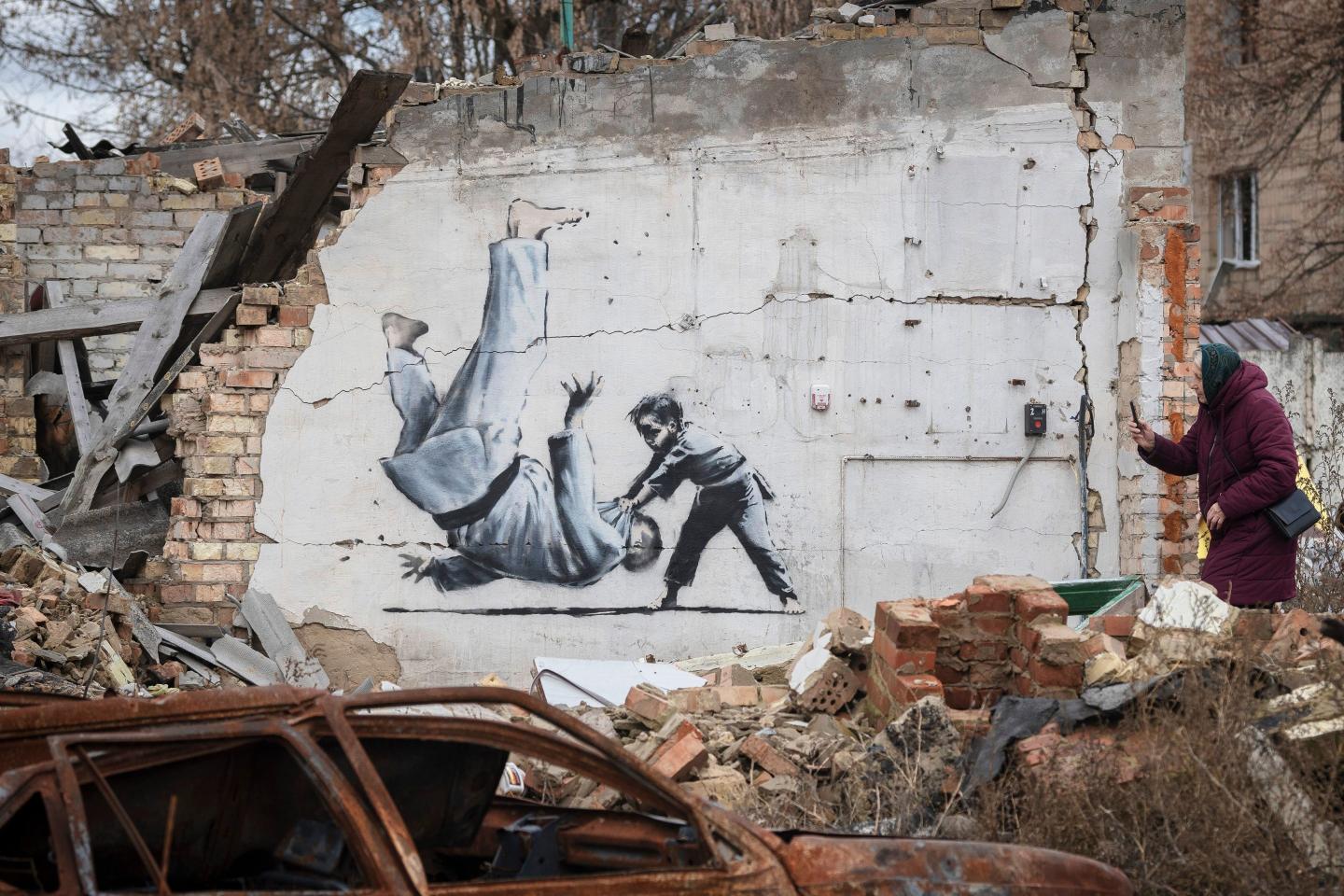 Banksy may have been identified, but his mystery has long been part of his art’s value, and a fan says it’s like finding out Santa Claus isn’t real