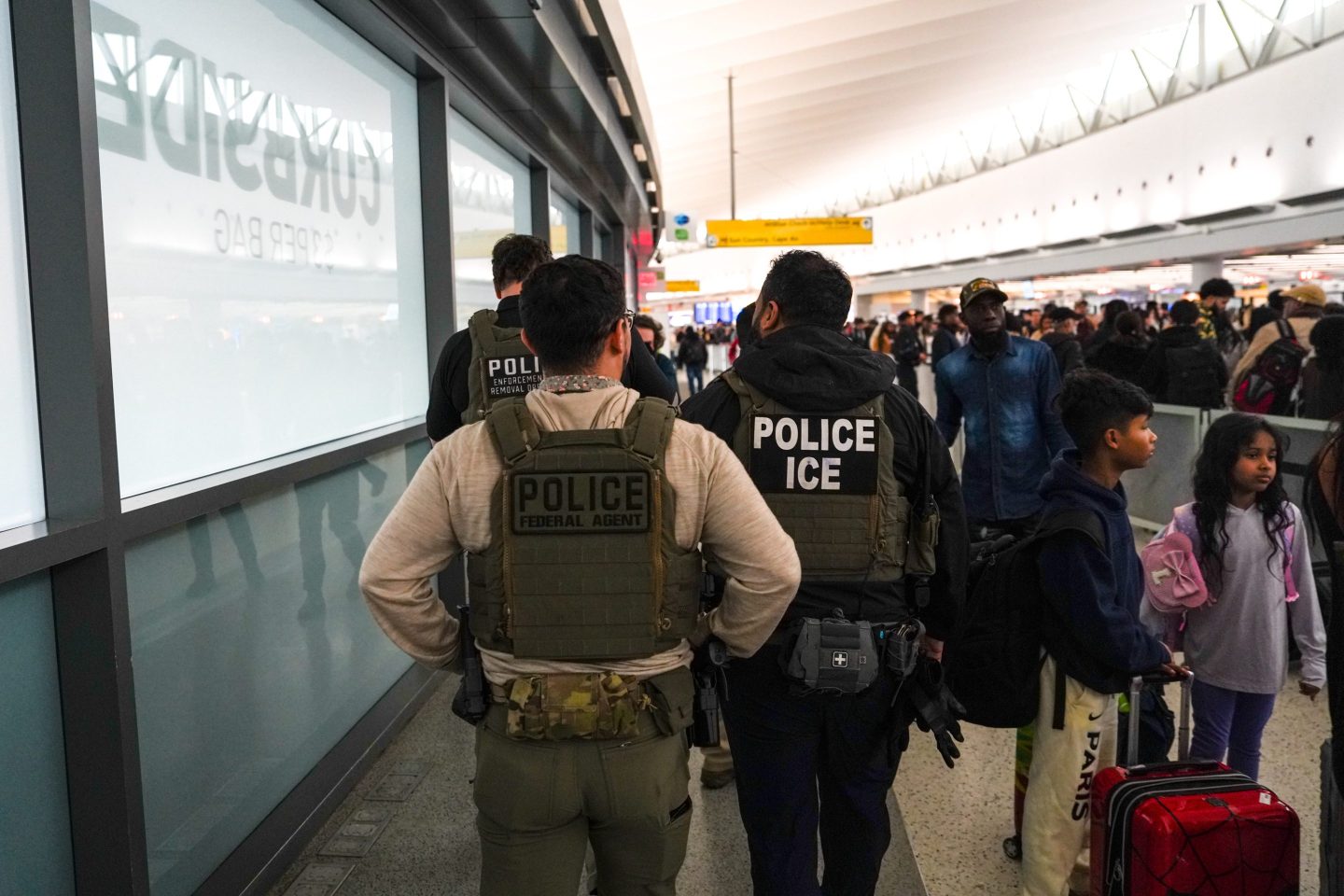 ICE officers in an airport