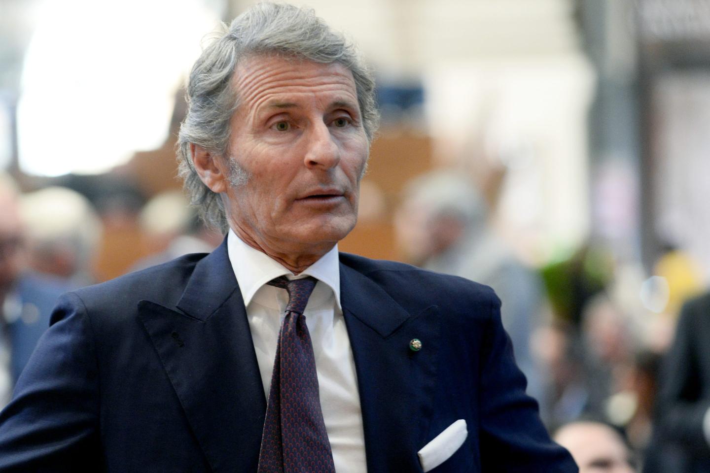 Stephan Winkelmann looks forward. He is wearing a suit.