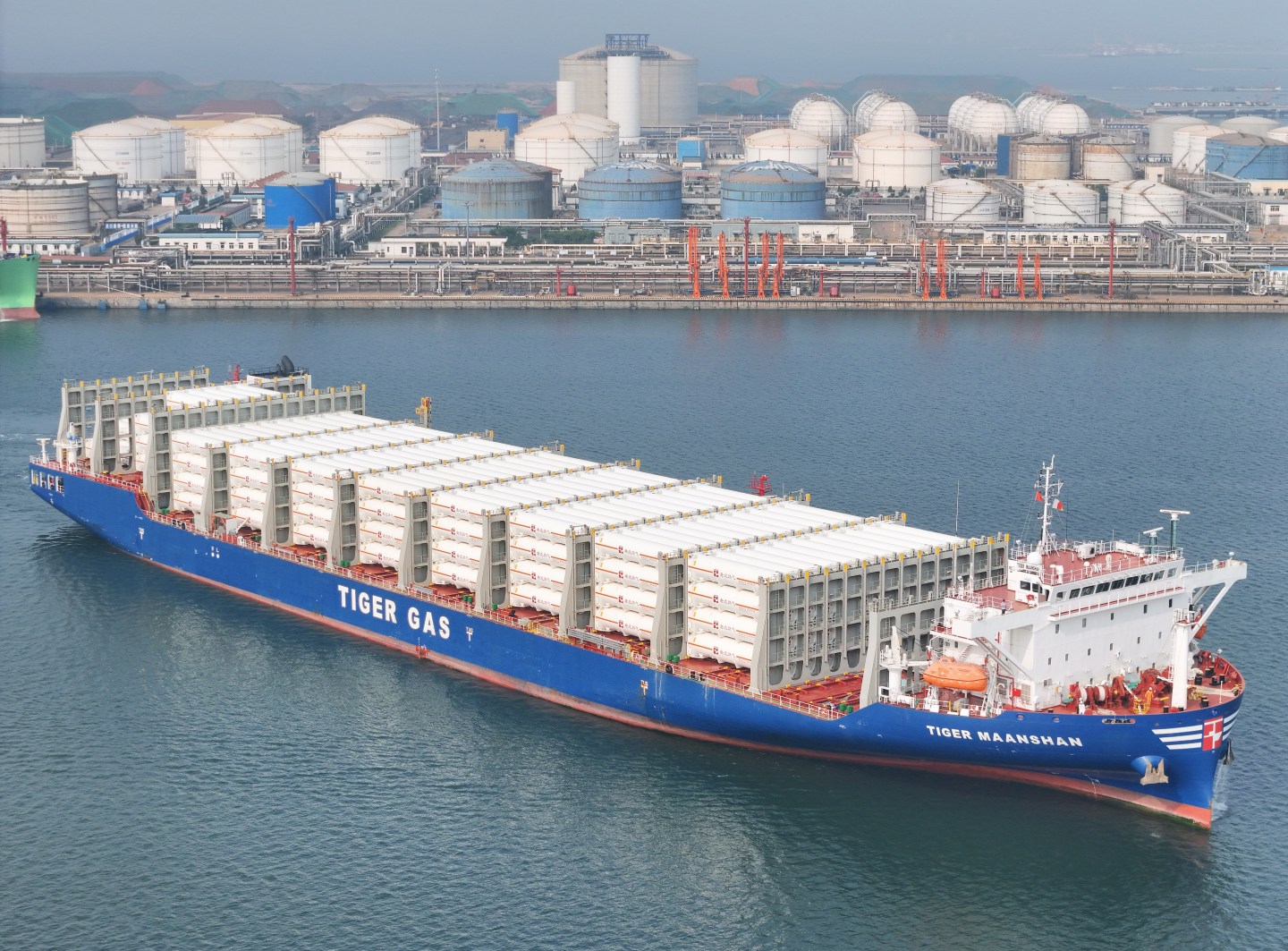 YANTAI, CHINA - SEPTEMBER 11, 2023 - A large LNG tank deck ship loaded with liquefied natural gas imported from Malaysia is docked at the Longkou Port area of Yantai Port in Yantai, Shandong province, China, September 11, 2023. As the country's first oil and gas terminal, tank farm, pipeline integrated operation of the port, Yantai port from Malaysia, Russia, Brazil, Oman, the United Arab Emirates, Singapore and other countries along the "Belt and Road" the proportion of imported oil and gas increased year by year, the first eight months of 2023 reached 86%. (Photo by Costfoto/NurPhoto via Getty Images)