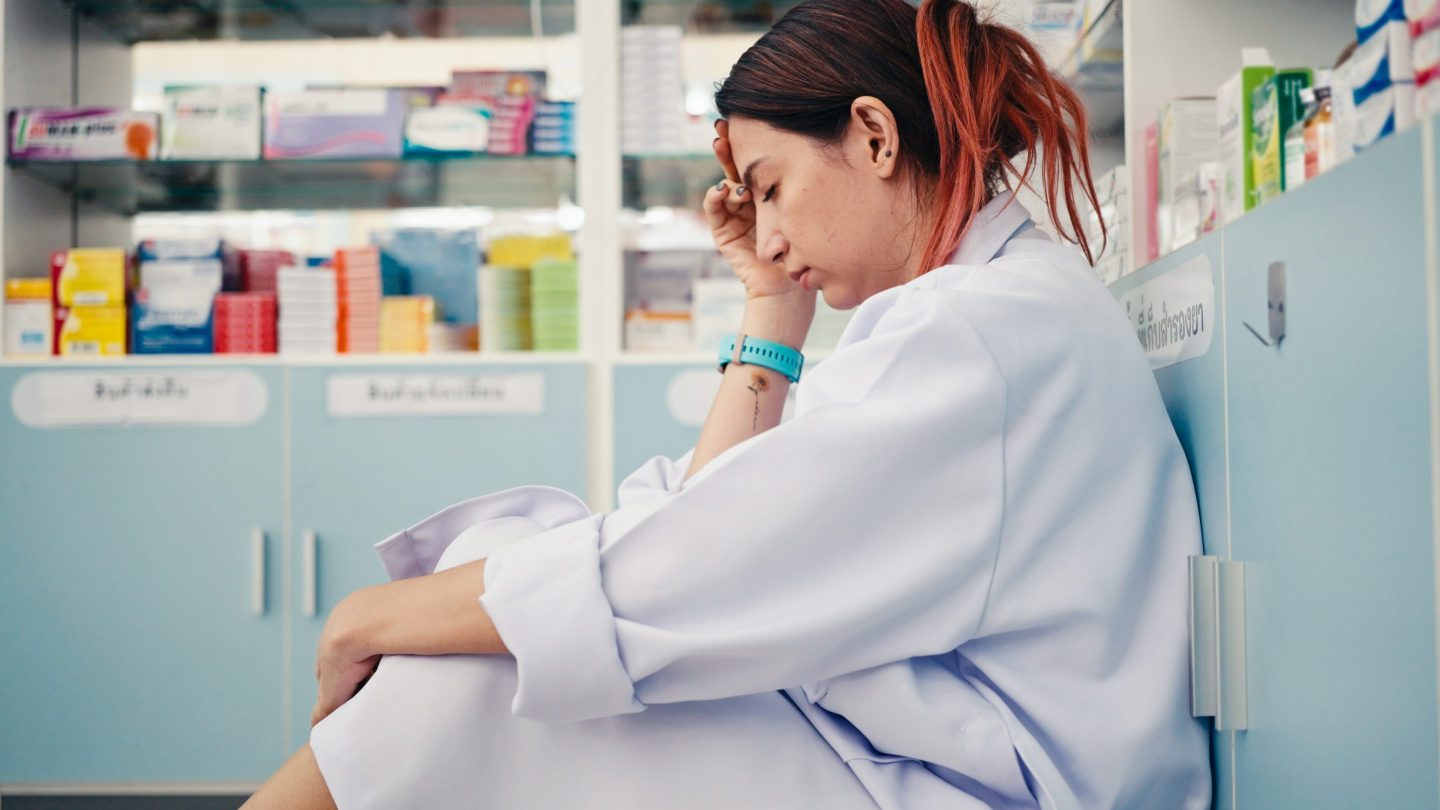 Stressed Gen Z pharmacy worker