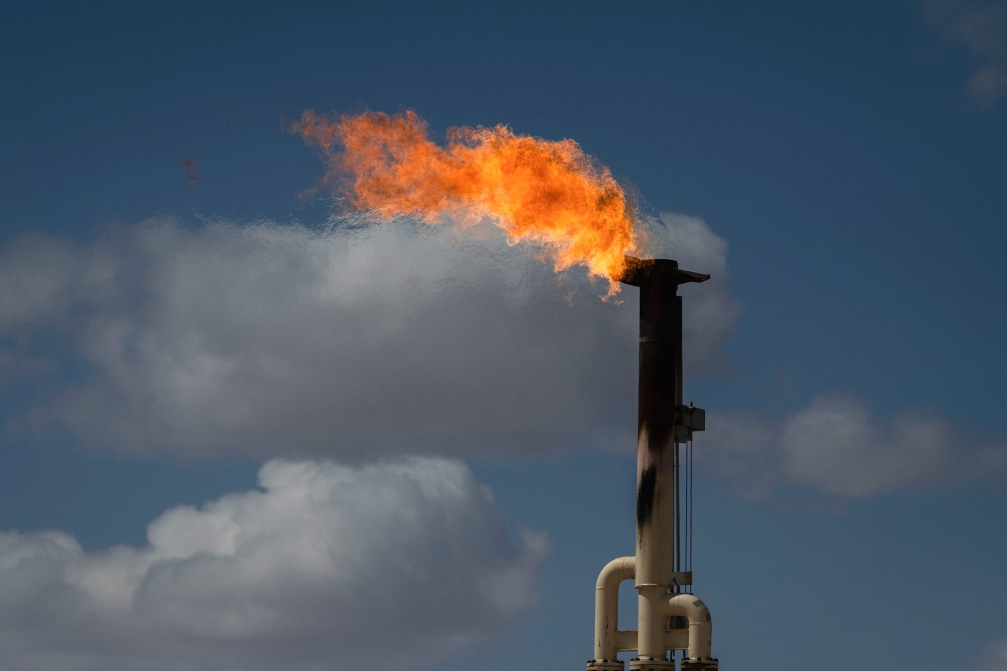 Flares burn off excess natural gas at the Endeavor Energy Resources LP oil and gas wells near Tarzan, Texas, US, on Saturday, March 15, 2025. The Permian Basin, a sprawling shale patch that lies beneath Texas and New Mexico, is North America's most prolific shale patch. Photographer: Justin Hamel/Bloomberg via Getty Images
