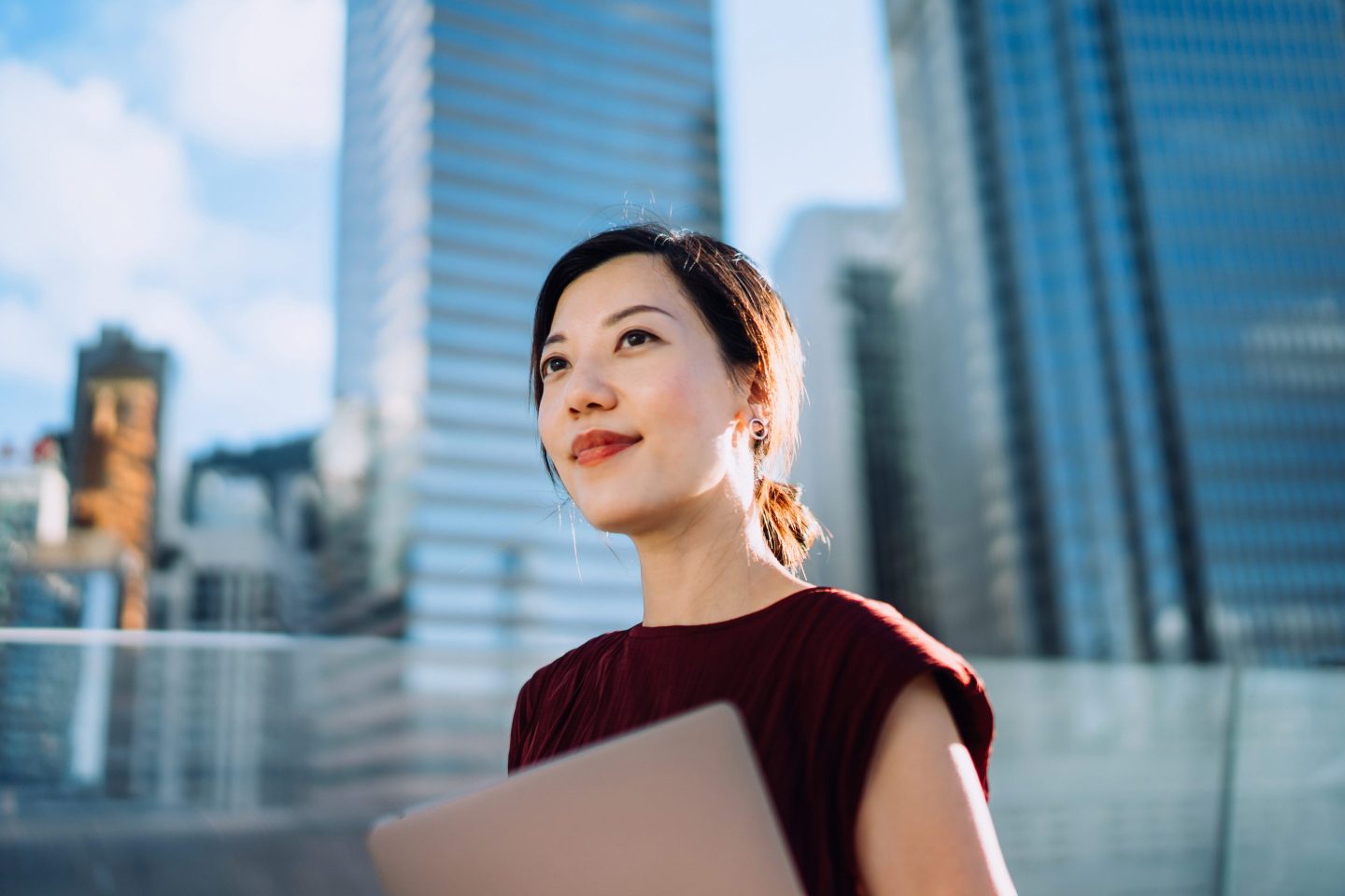 Working woman standing outside office happy