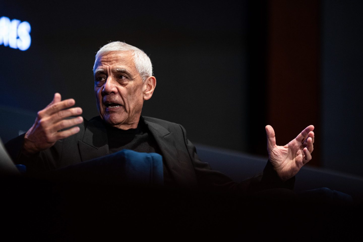 Khosla gestures with both hands