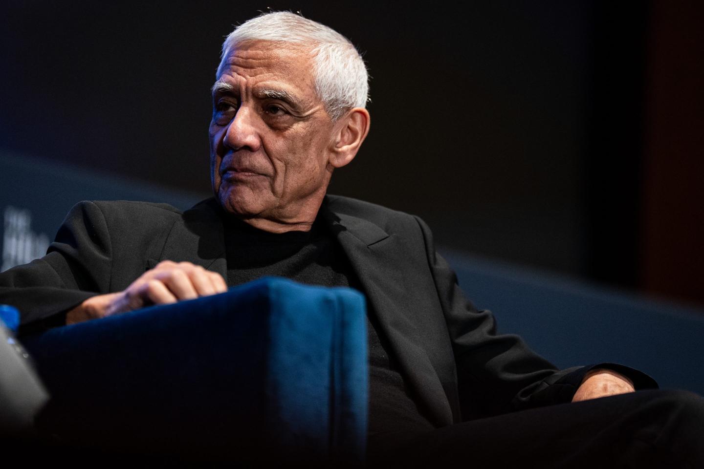 Vinod Khosla sits on a blue chair