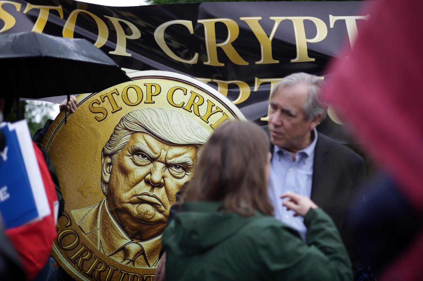 Demonstrators outside the last Trump memecoin dinner in May 2025.