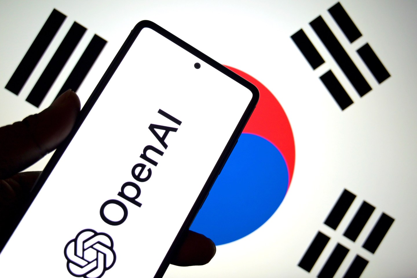 OpenAI logo is seen in this photo illustration with the South Korean flag in the background
